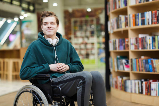Young man sitting in a library